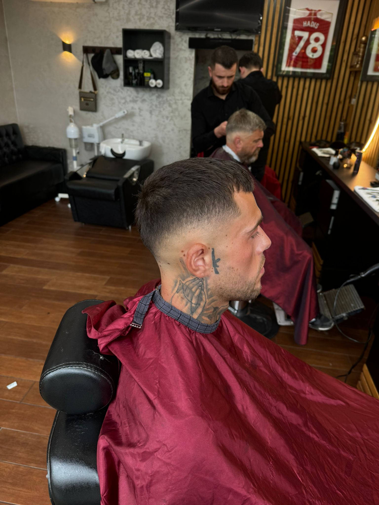 A finished fade inside the busy Hadi's barbershop