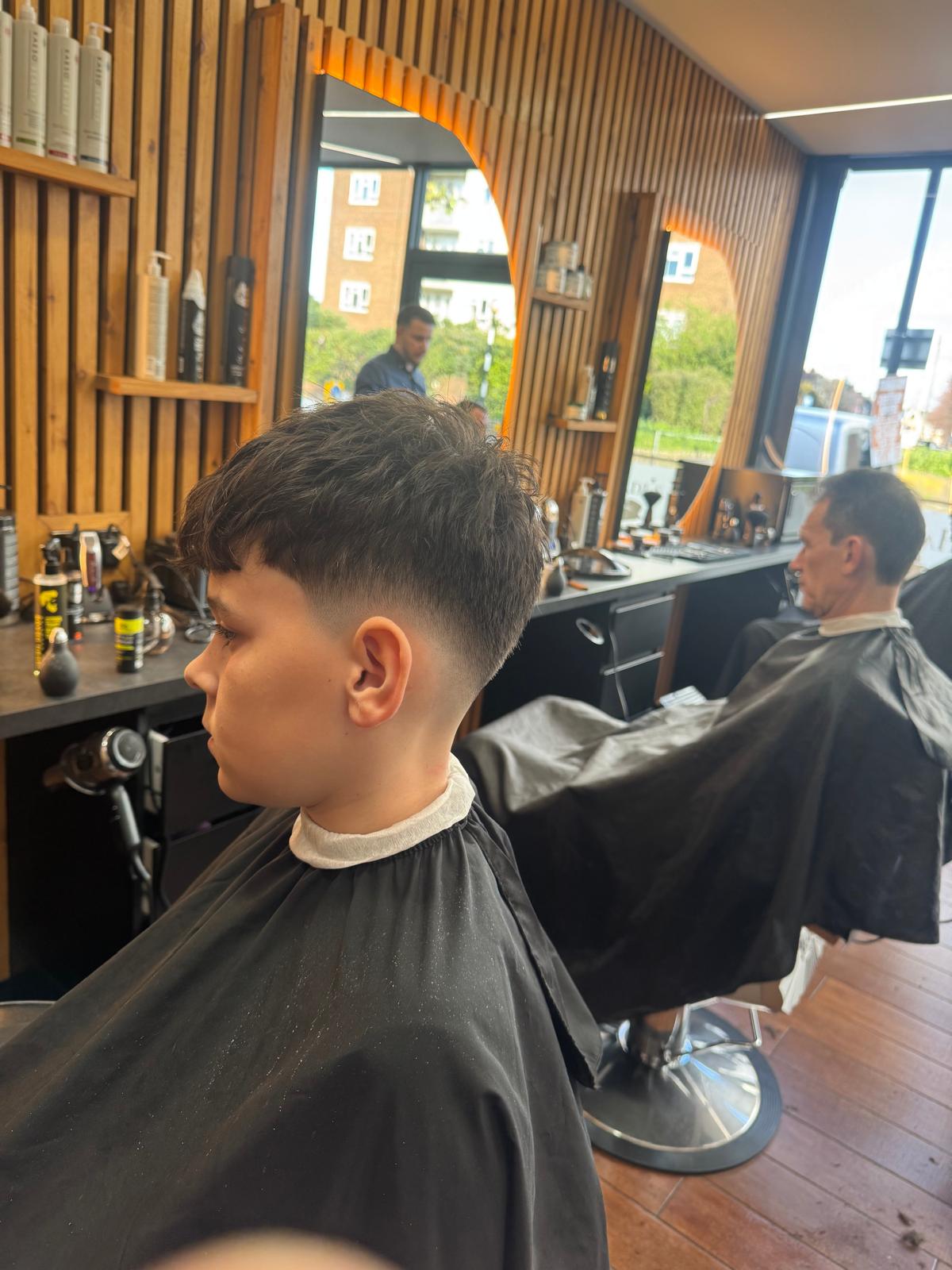 A young client with a fresh textured fade